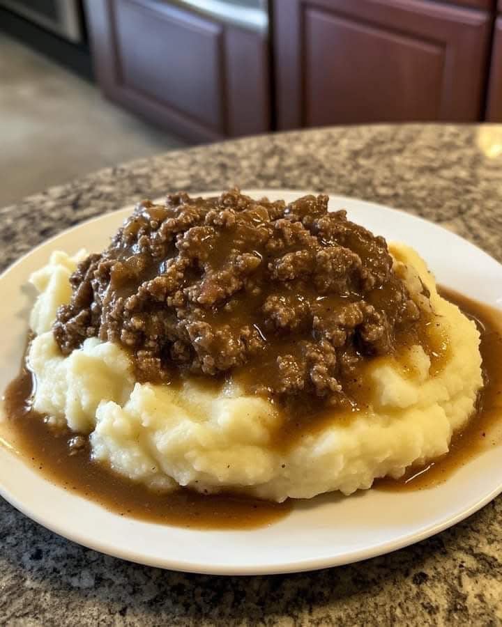 GROUND BEEF AND GRAVY OVER MASHED POTATOES